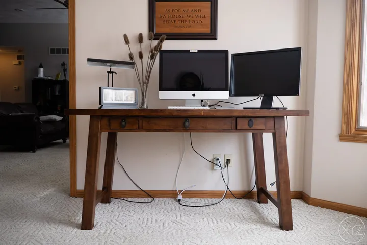 Clean desk with cables routed through 3D printed hexagonal clips
