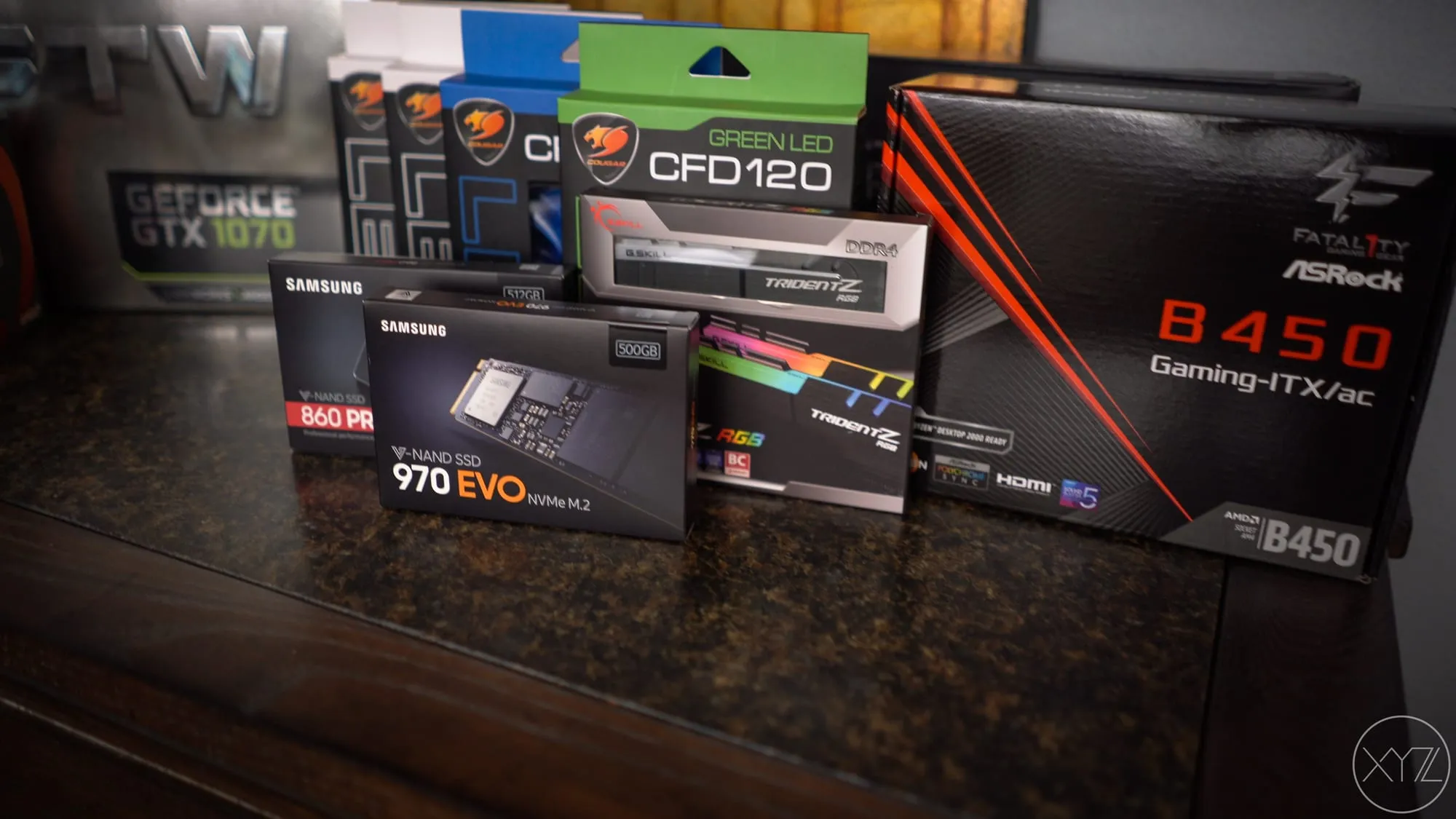 Finished InWin A1 PC next to a monitor on a desk